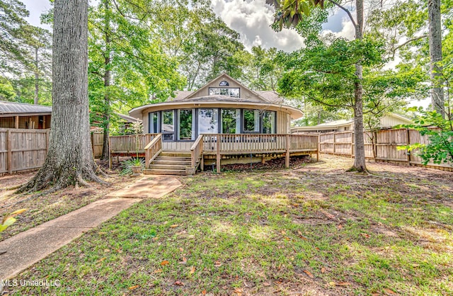 363 Lake Harbor Rd, Brandon, MS 39047 - back of property with a deck, a fenced backyard, and a sunroom