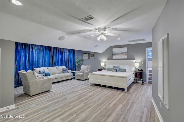 363 Lake Harbor Rd, Brandon, MS 39047 - bedroom featuring light wood-type flooring, ceiling fan, lofted ceiling, a textured ceiling, and baseboards