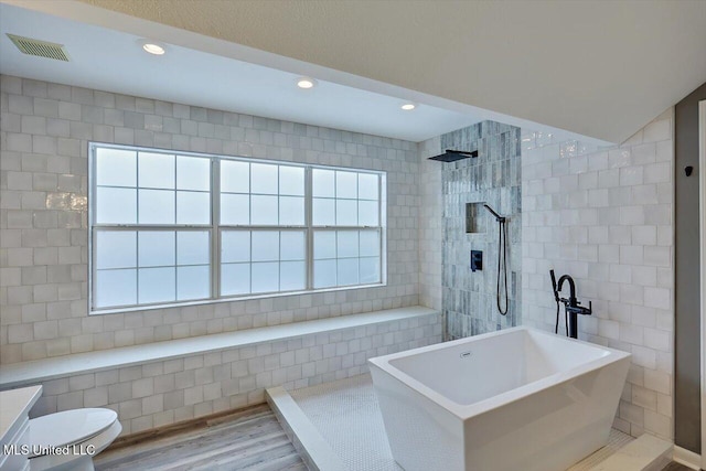 363 Lake Harbor Rd, Brandon, MS 39047 - full bath featuring walk in shower, wood finished floors, recessed lighting, toilet, and a soaking tub