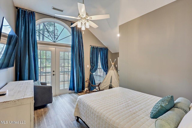 363 Lake Harbor Rd, Brandon, MS 39047 - bedroom featuring access to exterior, french doors, wood finished floors, vaulted ceiling, and a ceiling fan