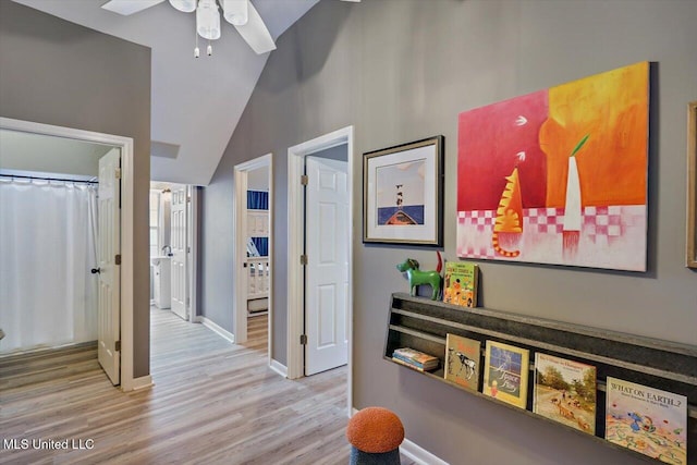 363 Lake Harbor Rd, Brandon, MS 39047 - hallway with wood finished floors, baseboards, and vaulted ceiling
