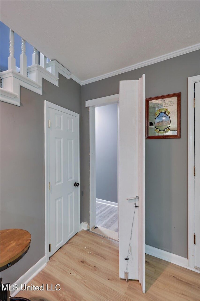 363 Lake Harbor Rd, Brandon, MS 39047 - hall with light wood-style flooring, crown molding, and baseboards