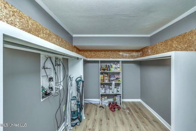 363 Lake Harbor Rd, Brandon, MS 39047 - finished basement with wood finished floors, ornamental molding, and a textured ceiling