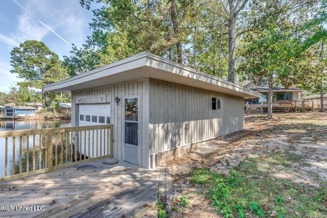 363 Lake Harbor Rd, Brandon, MS 39047 - view of side of property with a deck with water view, an outdoor structure, and a detached garage