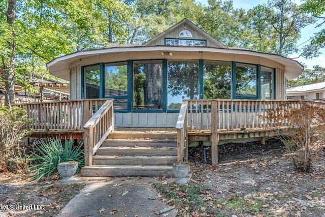 363 Lake Harbor Rd, Brandon, MS 39047 - view of front facade with a wooden deck and a sunroom