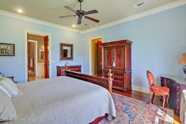 bedroom featuring crown molding, hardwood / wood-style floors, ensuite bath, and ceiling fan