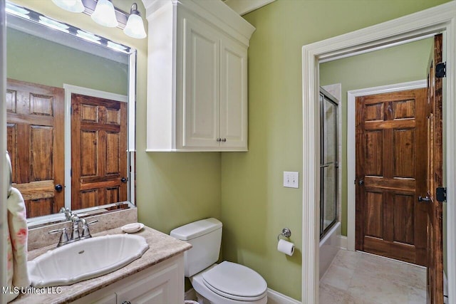 full bathroom with vanity, shower / bath combination with glass door, and toilet