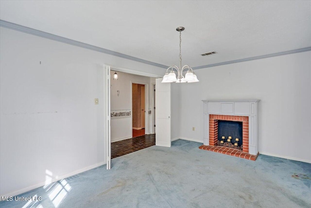 unfurnished living room with crown molding, a fireplace, carpet, and a chandelier