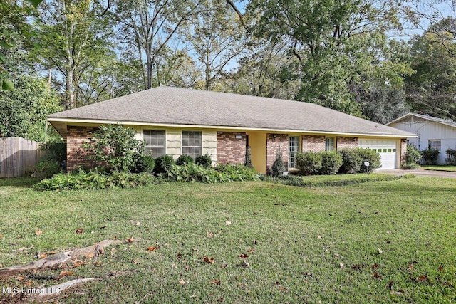 single story home with a garage and a front lawn