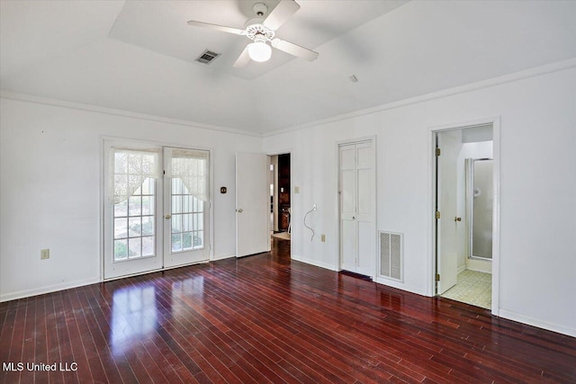 unfurnished bedroom with connected bathroom, ceiling fan, french doors, dark hardwood / wood-style floors, and lofted ceiling