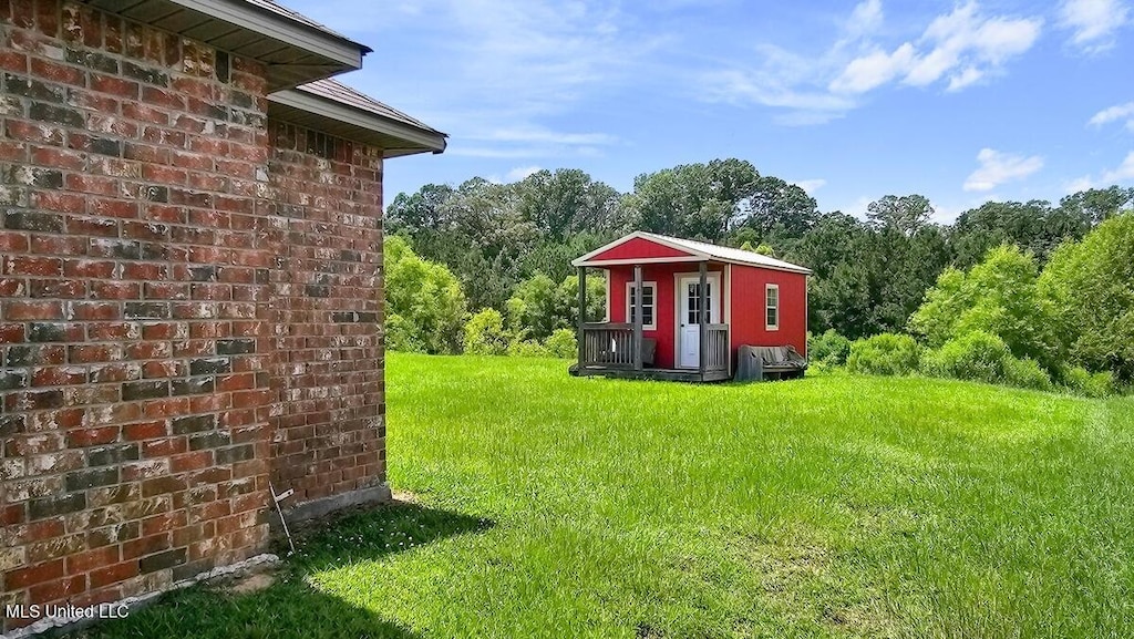 608 Carson Dr, Byram, MS 39272 - view of grassy yard featuring an outbuilding