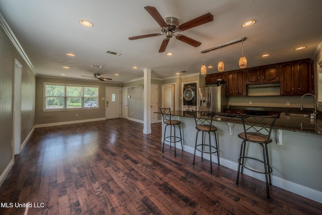 2623 Demaret Dr, Gulfport, MS 39507 - kitchen with a sink, stainless steel fridge with ice dispenser, ceiling fan, ornamental molding, and a breakfast bar area