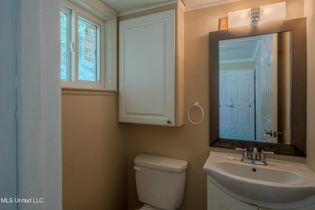 2623 Demaret Dr, Gulfport, MS 39507 - bathroom with toilet, vanity, and crown molding