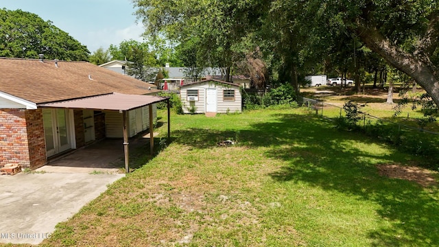 2623 Demaret Dr, Gulfport, MS 39507 - view of yard with concrete driveway, french doors, and an attached carport