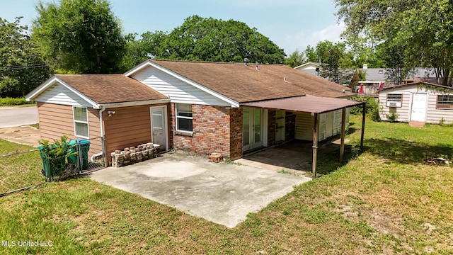 2623 Demaret Dr, Gulfport, MS 39507 - rear view of property featuring roof with shingles, driveway, a carport, and brick siding