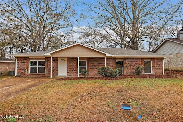 ranch-style home with cooling unit and a front lawn