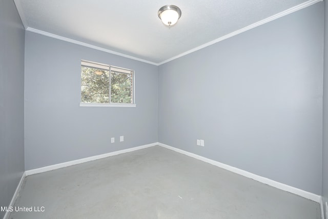 unfurnished room featuring concrete flooring, a textured ceiling, and ornamental molding