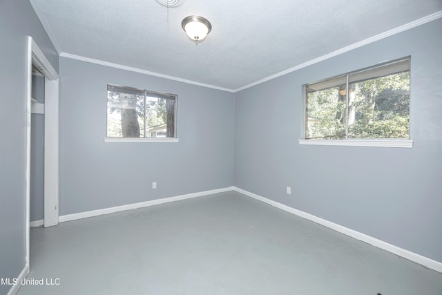 unfurnished bedroom featuring concrete flooring, multiple windows, and crown molding