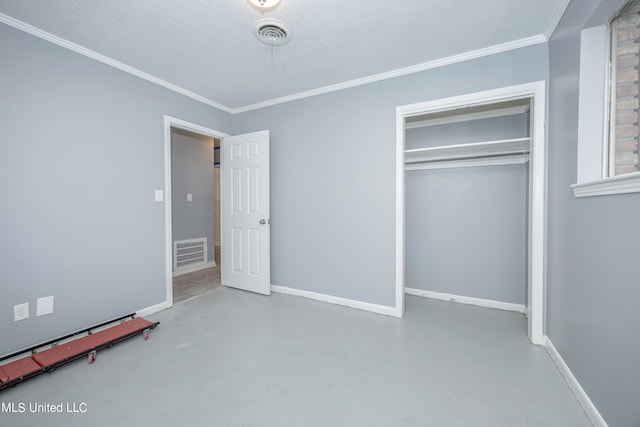 unfurnished bedroom with a closet, a textured ceiling, and ornamental molding