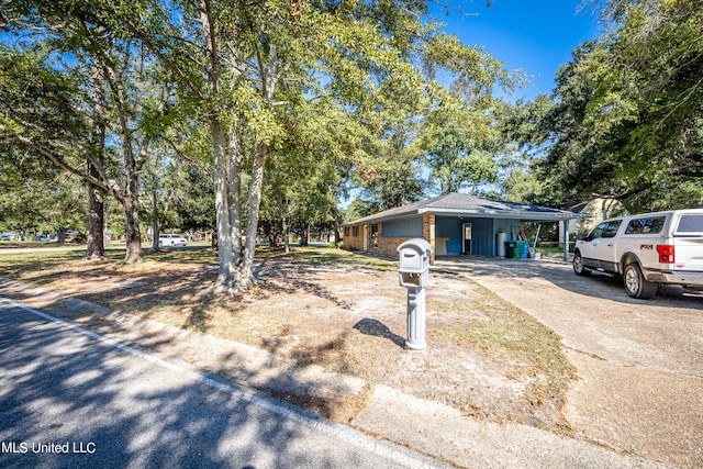 view of front of home with a carport