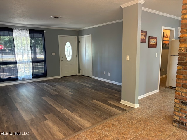 foyer with hardwood / wood-style floors and ornamental molding