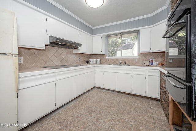 kitchen with electric cooktop, white cabinetry, and ornamental molding