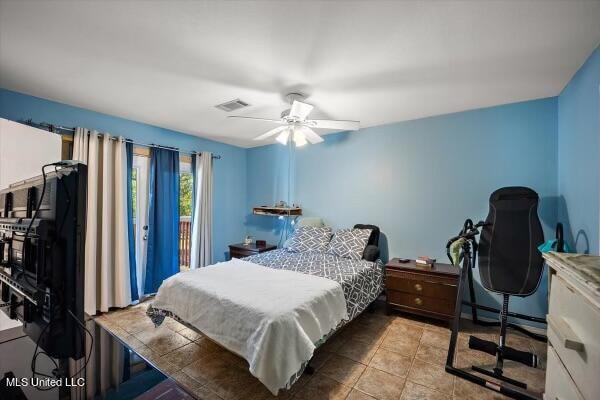 bedroom featuring ceiling fan and access to exterior