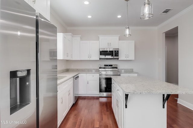 kitchen with appliances with stainless steel finishes, visible vents, and white cabinets