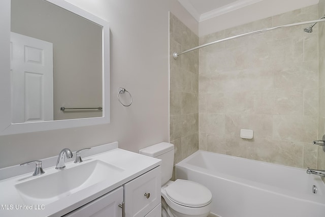 full bath featuring ornamental molding, bathtub / shower combination, vanity, and toilet