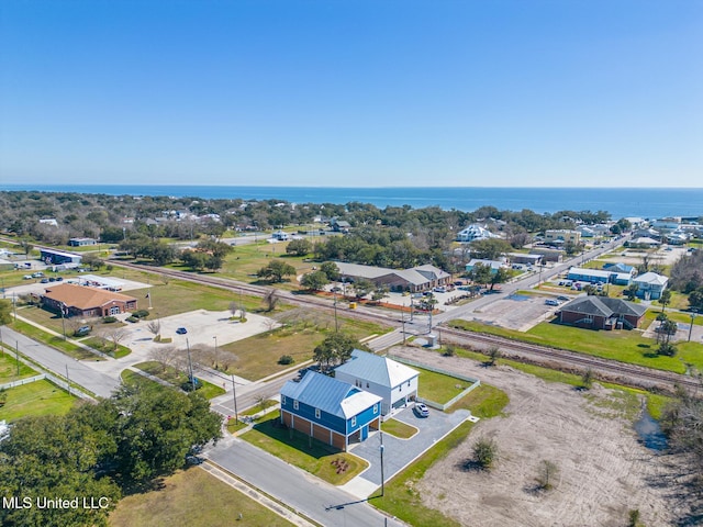 drone / aerial view with a water view and a residential view