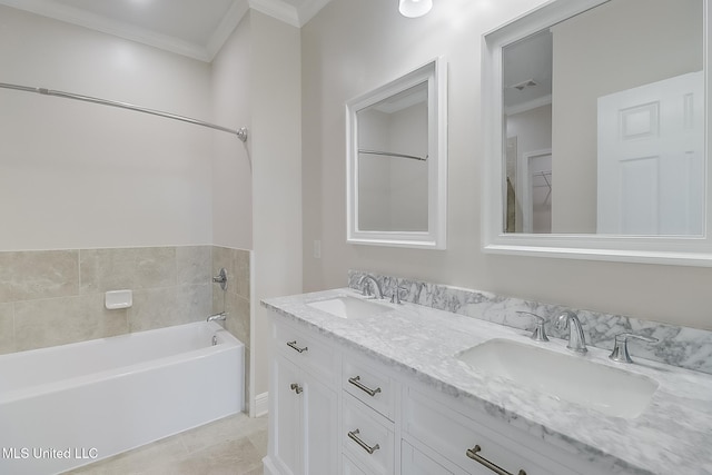 full bath with double vanity, ornamental molding, a sink, and a washtub