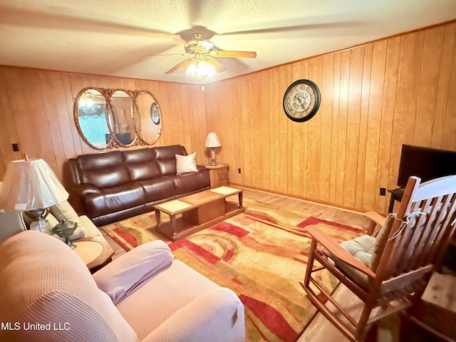 126 Lyon Dr, Grenada, MS 38901 - living room with ceiling fan and wooden walls