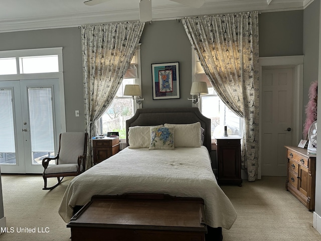 bedroom with french doors, light colored carpet, and crown molding