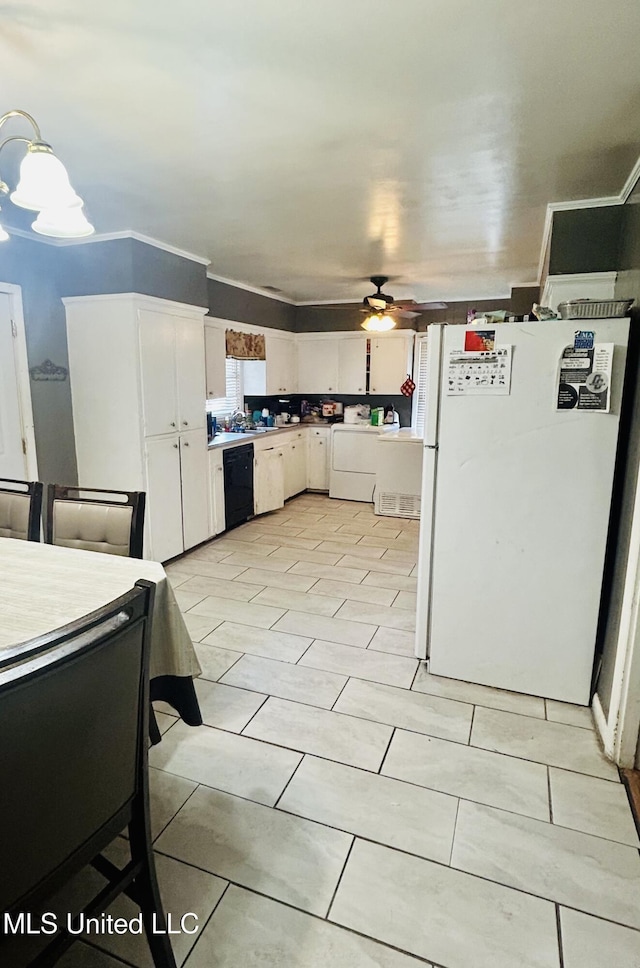201 Seymour Dr, Indianola, MS 38751 - kitchen with light countertops, freestanding refrigerator, white cabinetry, dishwasher, and ceiling fan with notable chandelier