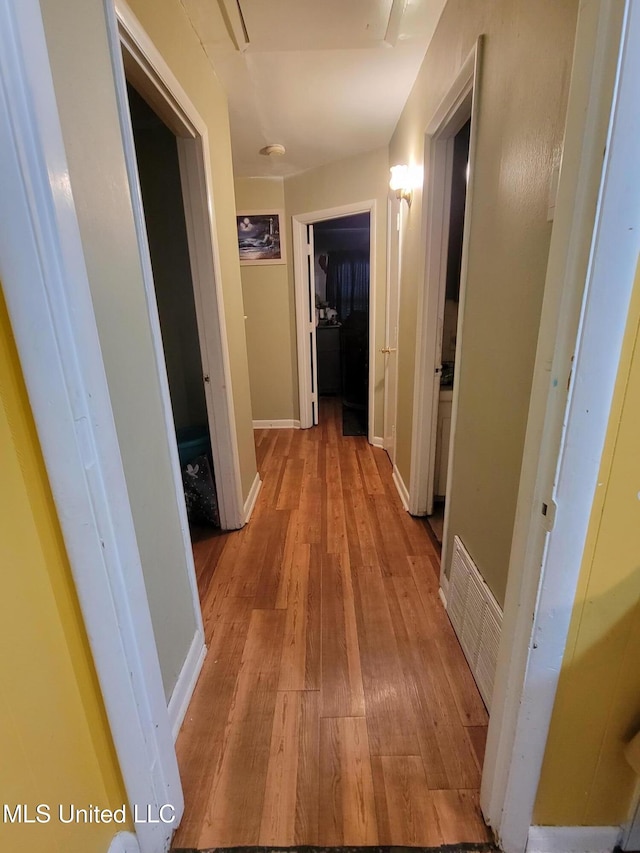 201 Seymour Dr, Indianola, MS 38751 - hallway featuring light wood-style flooring, baseboards, and visible vents