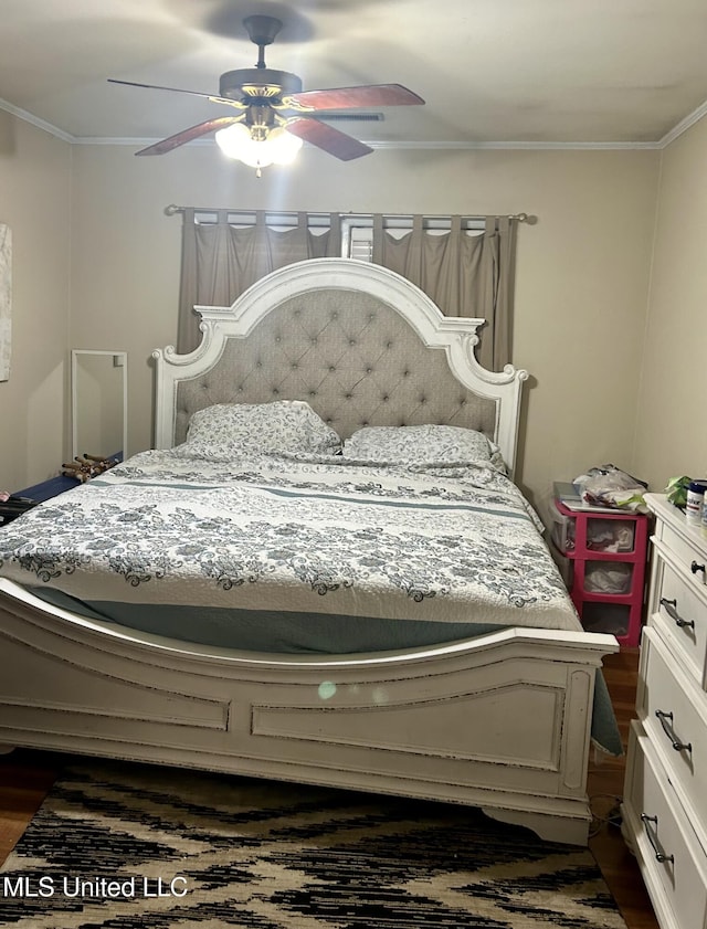 201 Seymour Dr, Indianola, MS 38751 - bedroom with a ceiling fan, ornamental molding, and dark wood-type flooring