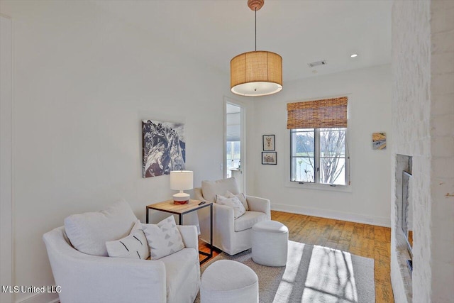 living room with light hardwood / wood-style flooring