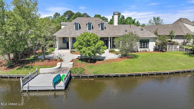 exterior space with a yard and a water view