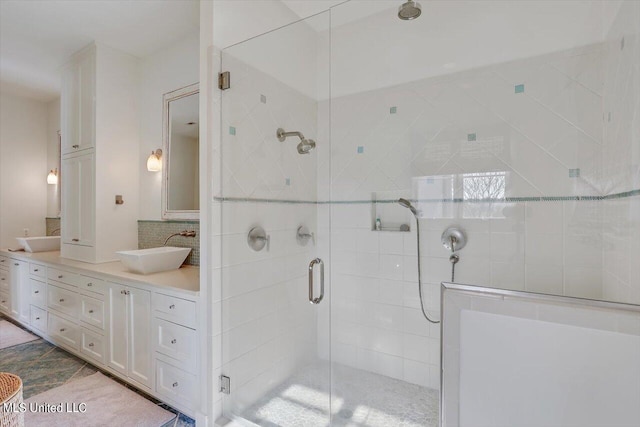 bathroom with vanity and an enclosed shower