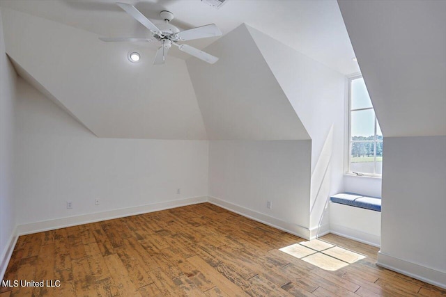 additional living space with lofted ceiling, light hardwood / wood-style floors, and ceiling fan