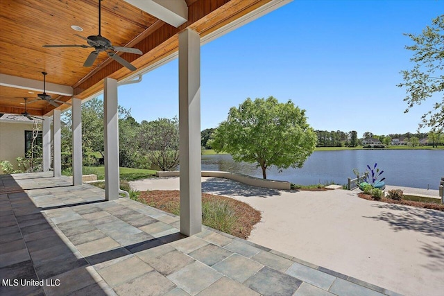 view of patio / terrace with a water view and ceiling fan