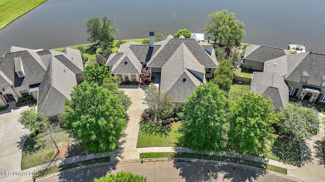 birds eye view of property with a water view