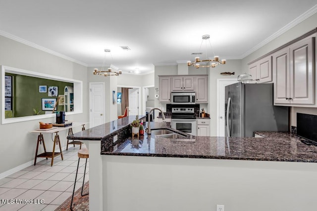 807 Woodglen Dr, Ocean Springs, MS 39564 - kitchen featuring a chandelier, stainless steel appliances, a sink, light tile patterned flooring, and ornamental molding