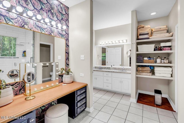 807 Woodglen Dr, Ocean Springs, MS 39564 - full bathroom featuring tile patterned flooring, double vanity, a shower stall, toilet, and baseboards