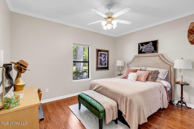 807 Woodglen Dr, Ocean Springs, MS 39564 - bedroom with wood finished floors, crown molding, baseboards, and a ceiling fan