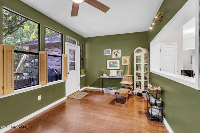 807 Woodglen Dr, Ocean Springs, MS 39564 - living area featuring ceiling fan, wood finished floors, and baseboards