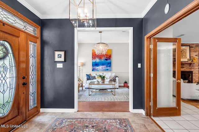 807 Woodglen Dr, Ocean Springs, MS 39564 - entrance foyer with a chandelier, crown molding, and baseboards