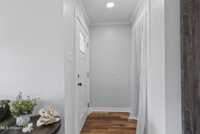 hall with dark hardwood / wood-style flooring and crown molding