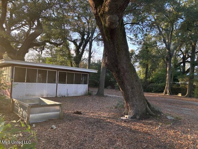 view of yard featuring a sunroom