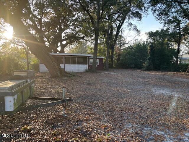 view of yard featuring a sunroom